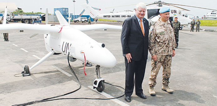 Herve Ladsous (L), head of the UN Peacekeeping Operations during the official launching ceremony of an Italian-made surveillance drone at the airport 