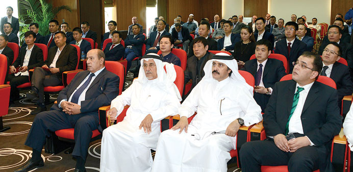 Qatari and Chinese businessmen attend a meeting at QC.