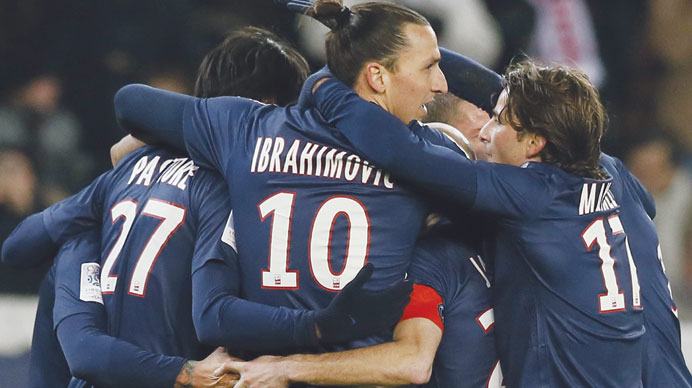 Paris Saint-Germain players celebrate their win over Lille during their French Ligue 1 match in Paris on Sunday night. (AFP)