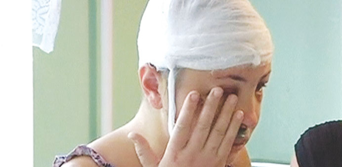   Krashkova is seen wiping away a tear during an interview in this still image taken from video.