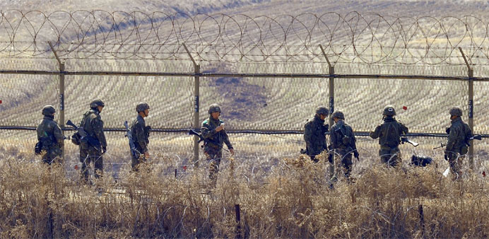 South Korean soldiers checking a military iron fence in the border city of Paju