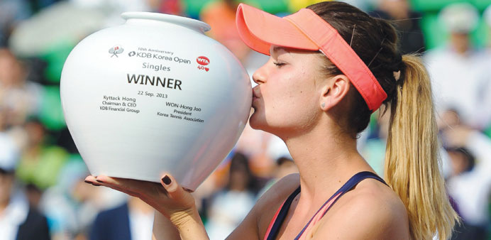 Agnieszka Radwanska kisses the trophy after winning the Korea Open final in Seoul yesterday. (AFP)