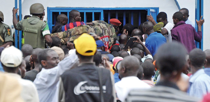 Civil servants wait in queue in front of a bank in Bangui yesterday.