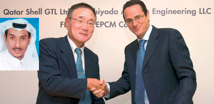 Wael Sawan (right) with Madoka Koda at the agreement signing. INSET: Saud Almana