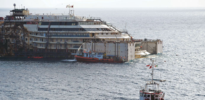 Water is expelled from a caisson during a test yesterday on the wrecked Costa Concordia cruise ship.