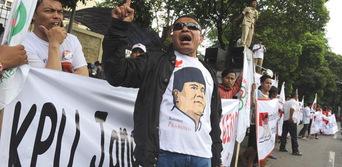 A group of supporters of presidential candidate Prabowo Subianto stage a protest outside the General Elections Commission in Jakarta.