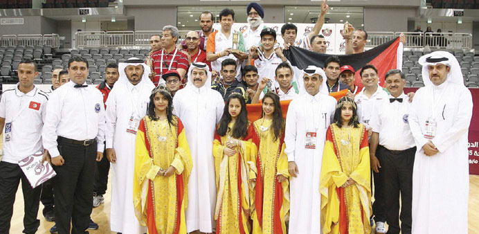 Qatar Boxing Federation president Yusuf Ali al-Kazim (centre) and officials pose with the winners.