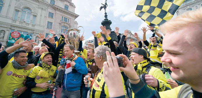 Fans of Borussia Dortmund gather in Piccadilly Circus in central London yesterdy, ahead of the UEFA Champions League football final between Bayern Mun
