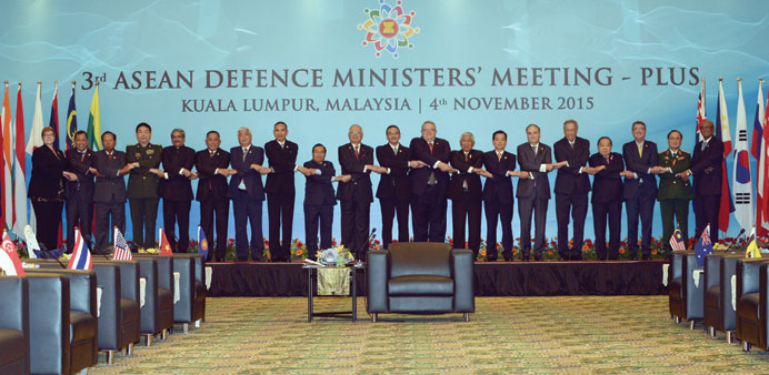 Officials pose for pictures during the Association of Southeast Asian Nations (Asean) Defence Ministers-PLUS meeting in Subang, on the outskirts of Ku