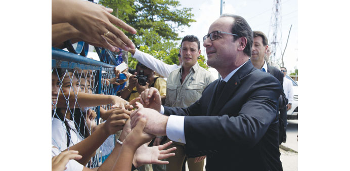 French President Francois Hollande  greets people during a visit to Guiuan, Eastern Samar province yesterday.