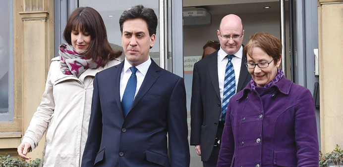 Labour Party Ed Miliband walks with Labour Party candidate for the Leeds West constituency Rachel Reeves (left) during a general election campaign vis