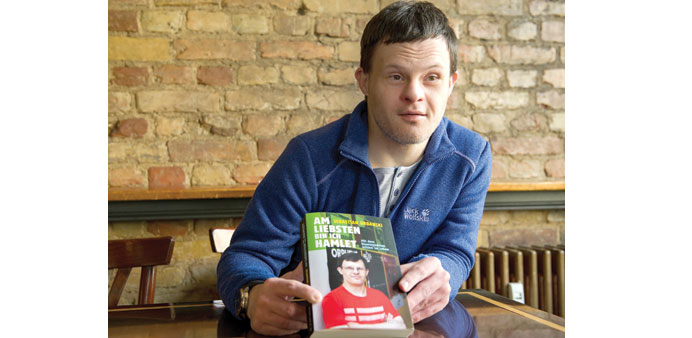 HIS STORY: Sebastian Urbanski, a German actor with Downu2019s syndrome, during an interview in Berlin. He is holding the biography published about him.
