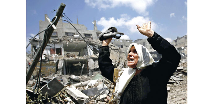 A woman cries as she flees from Shejaiya during the Israeli military operation yesterday.