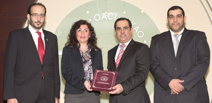 Brigadier Abdullah al-Buainain delivers Public Keys of Qatari e-passports to Christina from ICAO.