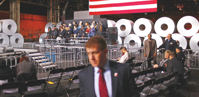 A Secret Service agent sweeps the seating area in anticipation of Obamau2019s arrival at the ArcelorMittal plant in Cleveland. Obama was to tour the plant