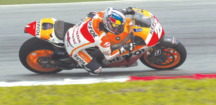 Dani Pedrosa rides his Honda around Sepang International Circuit near Kuala Lumpur during pre-season tests yesterday. (EPA)