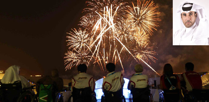 Athletes watch the opening ceremony of the Doha 2015 IPC Athletics World Championships at Katara yesterday. Inset: HE Dr Thani Abdulrahman al-Kuwari.