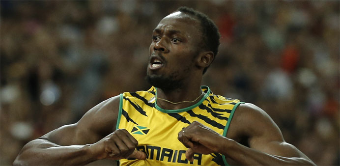 Jamaica's Usain Bolt celebrates after winning 