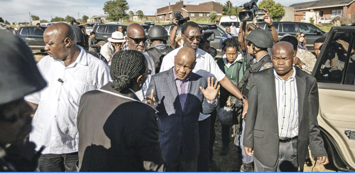 Lesotho Prime Minister Tom Thabane leaves a polling station outside Maseru.