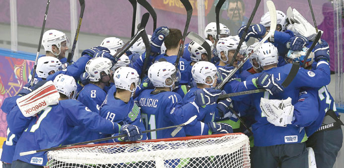 Slovenian players are ecstatic after their victory over Austria in the menu2019s ice hockey tournament at the Sochi Games, yesterday. (EPA)