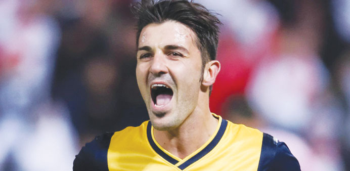 Atletico Madridu2019s David Villa celebrates after scoring against Granada during their Spanish league clash in Granada on Thursday. (Reuters)