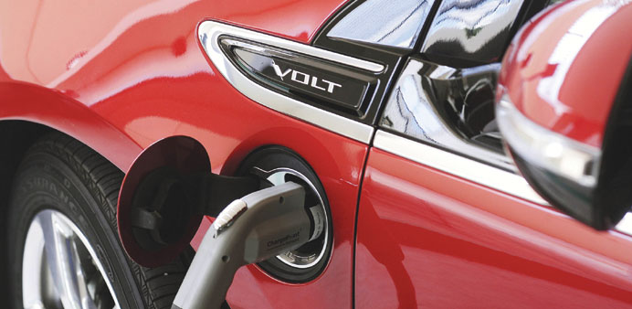 An electric car is charged as part of the Drive Electric Orlando programme in the parking garage of the Peabody Orlando Hotel in Orlando, Florida.