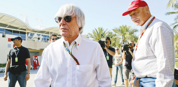 Formula One boss Bernie Ecclestone (left) and former Austrian driver Niki Lauda at the paddock prior the 2014 Bahrain Formula One Grand Prix yesterday