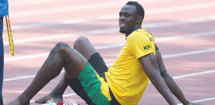 Usain Bolt takes a break during the Jamaican athletic teamu2019s training session in Moscow yesterday, ahead of the IAAF World Championships beginning tom