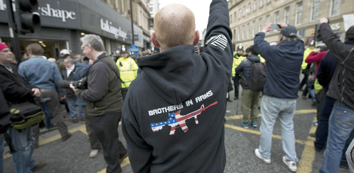 A man gestures at a protest by the UK branch of the German group Pegida, in the city centre of Newcastle upon Tyne.