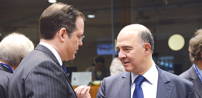 Moscovici (right) speaks with Swedenu2019s Borg prior to the start of the European Union Eco-Finance Council meeting attended by EU finance ministers and 