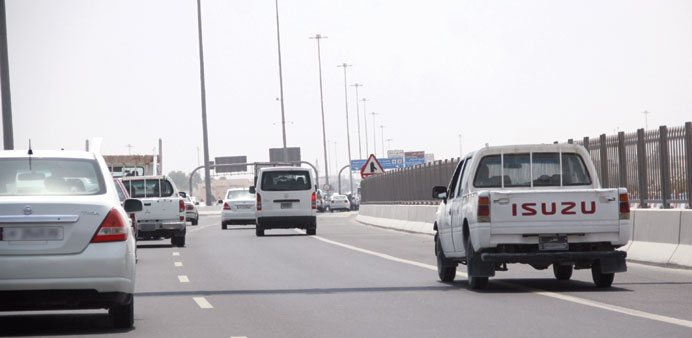 A vehicle (right) plying on the hard shoulder of a Doha highway. PICTURE: Najeer Feroke.