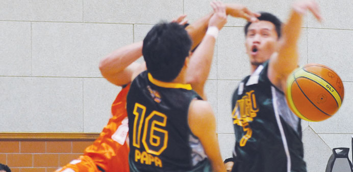 Players in action during a u2018Bu2019 Division match at the Subaru Cup 2012 of Pinoy Basketball of Qatar
