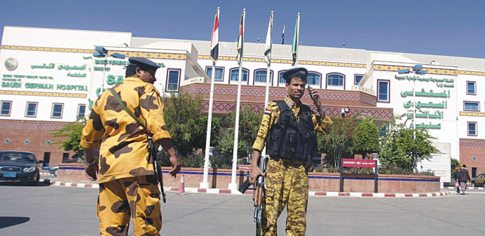 Police troopers stand guard outside a hospital where the Japanese diplomat is being treated after the attack in Sanaa yesterday.