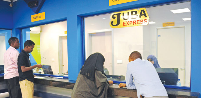 Customers wait to collect money at the Juba Express money transfer company in Mogadishu.