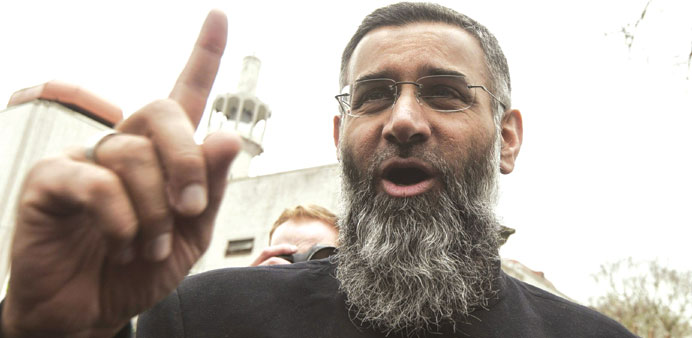 Anjem Choudary speaks during a rally calling for Muslims to refrain from voting in the 2015 general election outside the Regents Park mosque in London