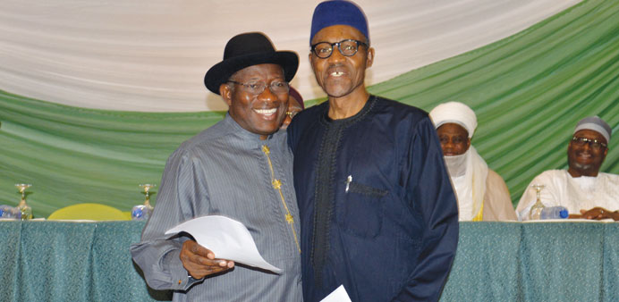 Jonathan (left) with Buhari after signing a peace accord in Abuja ahead of hotly contested elections tomorrow in an effort to prevent religious or eth