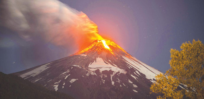 Lava pours out of the Villarrica volcano in southern Chile yesterday.