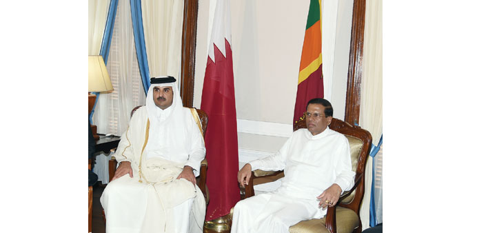 HH the Emir Sheikh Tamim bin Hamad al-Thani with Sri Lankan President Maithripala Sirisena in Colombo yesterday. 
