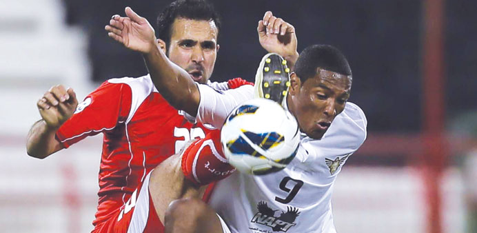  El Jaishu2019s Adriano (in white) gets into a tangle.