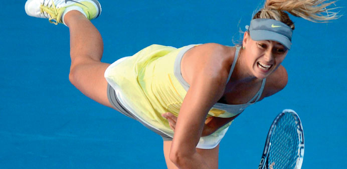 Russiau2019s Maria Sharapova serves during her womenu2019s singles match against Misaki Doi of Japan on the third day of the Australian Open tennis tournament