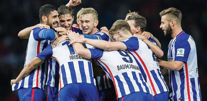 Hertha Berlin players celebrate their victory over  Hoffenheim in Berlin on November 22.