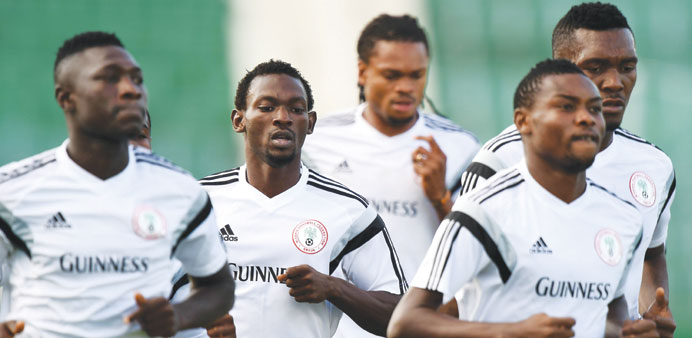 Nigeria defender Juwon Oshaniwa (2nd L) and other players warming up during a training session in Campinas.