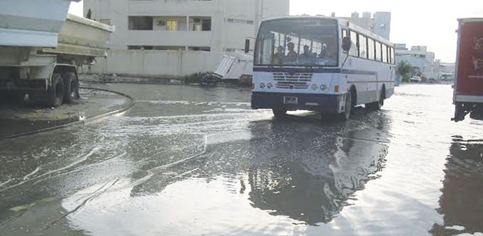 A bus makes its way through a waterlogged street in the Industrial Area. PICTURE: S Shihab