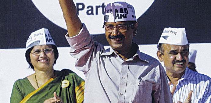 AAP leader and anti-graft activist Arvind Kejriwal waves to supporters during a campaign for his candidates in Bangalore.
