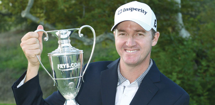 Jimmy Walker poses with the winneru2019s trophy after winning the Frys.com Open at the CordeValle Golf Club on Sunday in San Martin, California. (AFP)