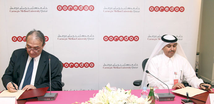 Sheikh Saud bin Nasser al-Thani and Ilker Baybars sign the partnership.