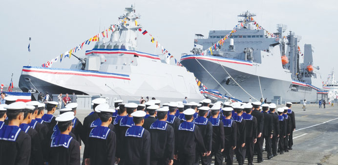 Navy sailors march past the 500-tonne corvette named u2018Tuo Chiangu2019 u2013 u2018Tuo Riveru2019 u2013 the first of its kind ever produced by Taiwan as u2018the fastest and mo
