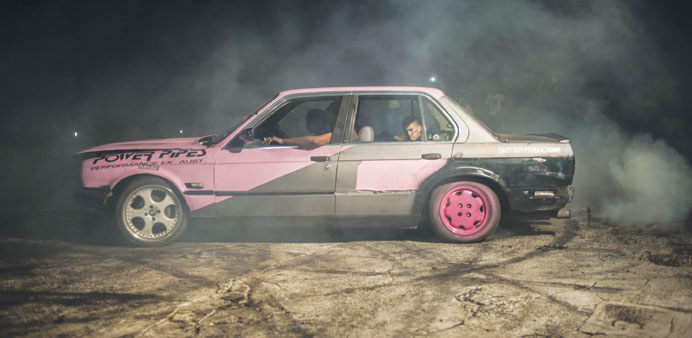 Stacey-Lee May (left) drives her car during a round of spinning at the Midway spinning event in Soweto.