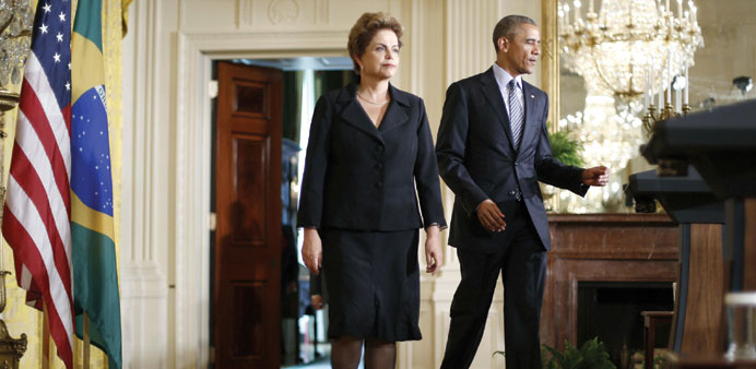 Brazilu2019s President Dilma Rousseff and US President Barack Obama arrive for a joint news conference in the East Room of the White House in Washington y