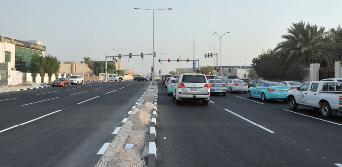 The widened stretch of Najma Street and the new signal near Woqod fuel station following the reopening. PICTURE: Najeer Feroke.